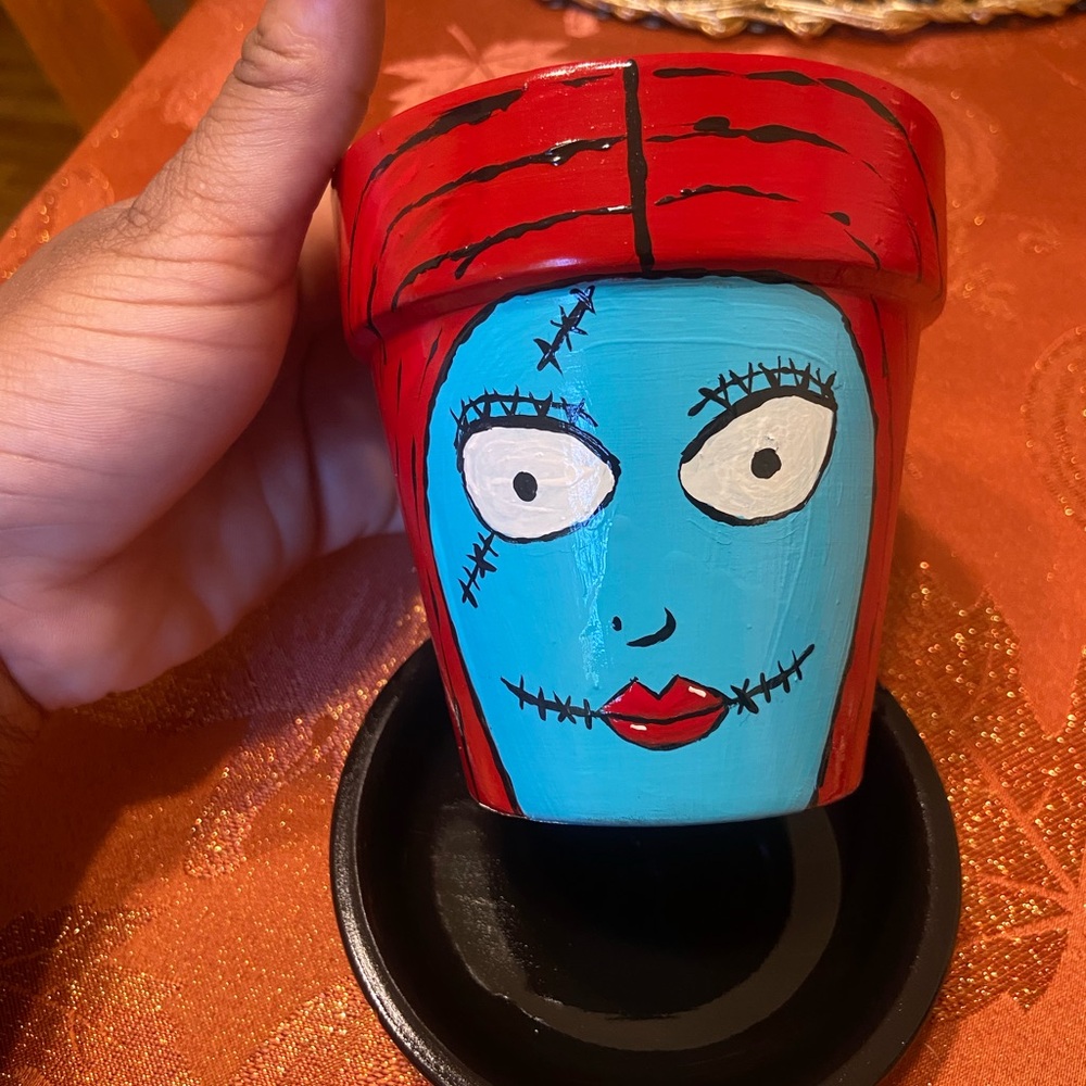 A hand painted 4in flower pot (Sally) from The Nightmare Before Christmas movie.